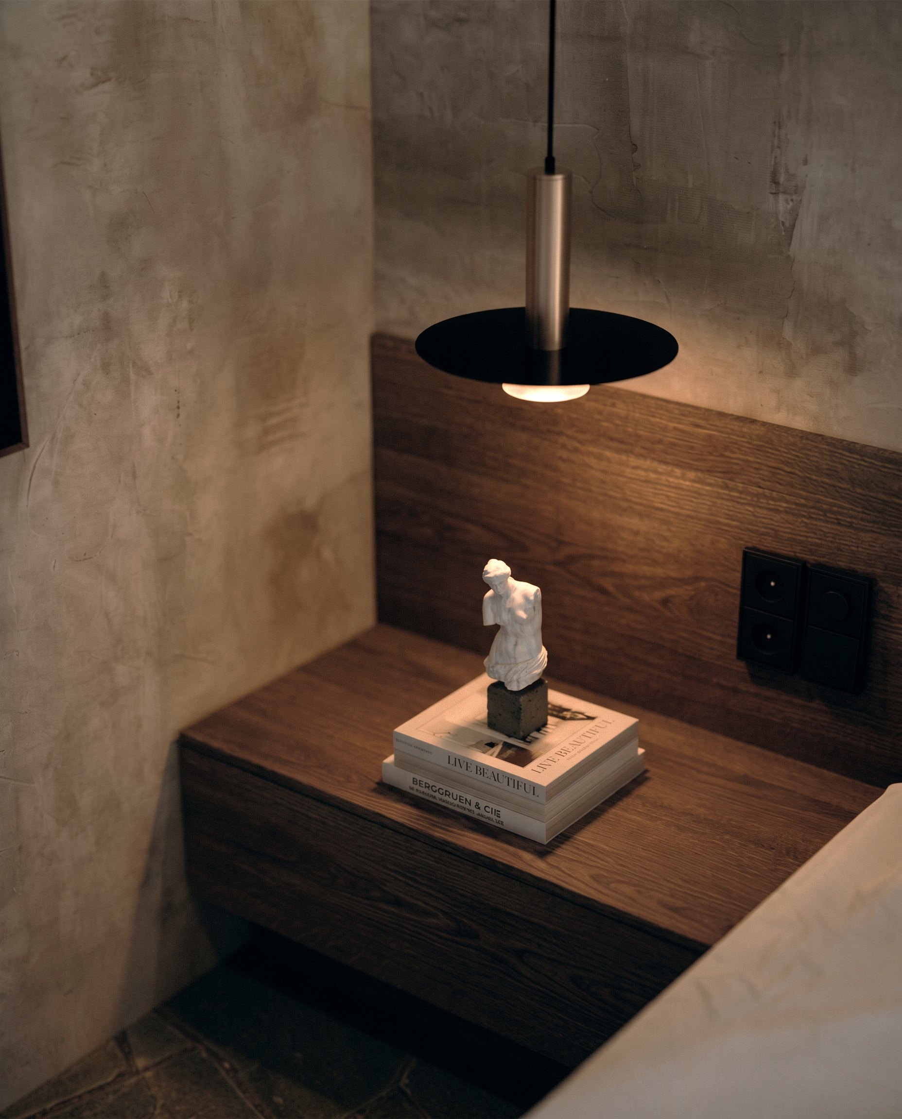 Bedside niche with pendant lamp and timber shelf