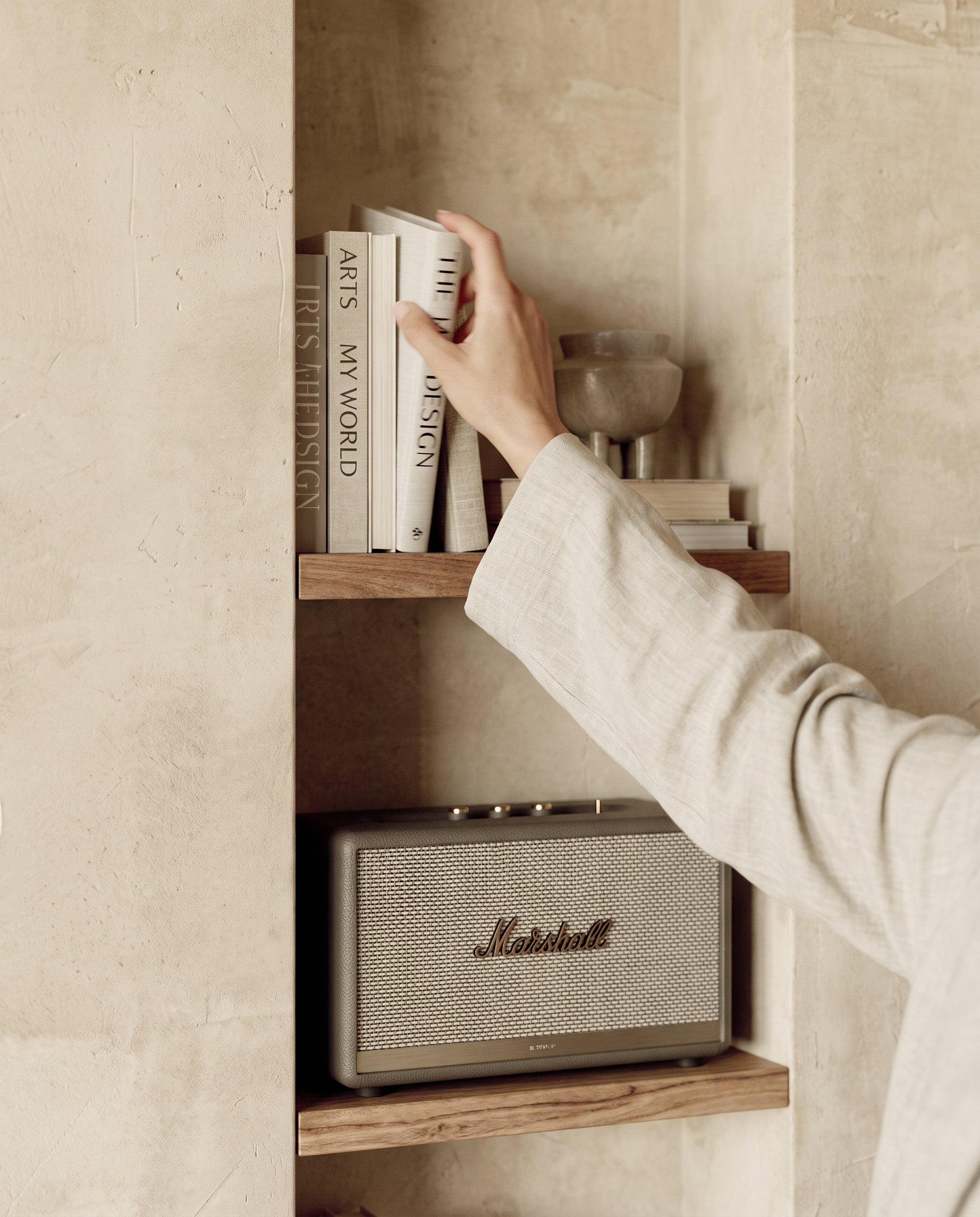 Plaster niche with books and a speaker