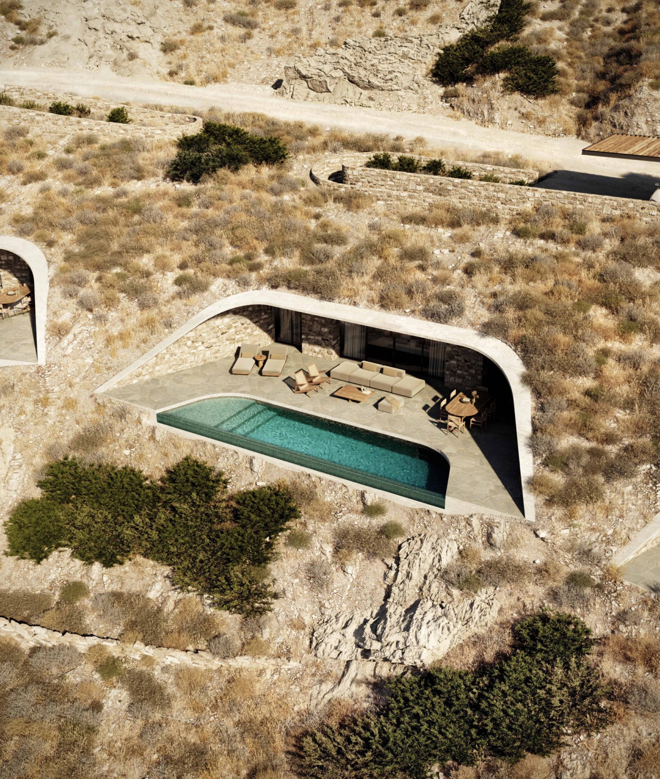 Villa C from above, set into the slope with its pool and terrace